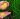 golden rice on the palm of a person in the field